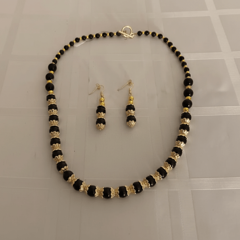 Black and gold beaded necklace and earrings 